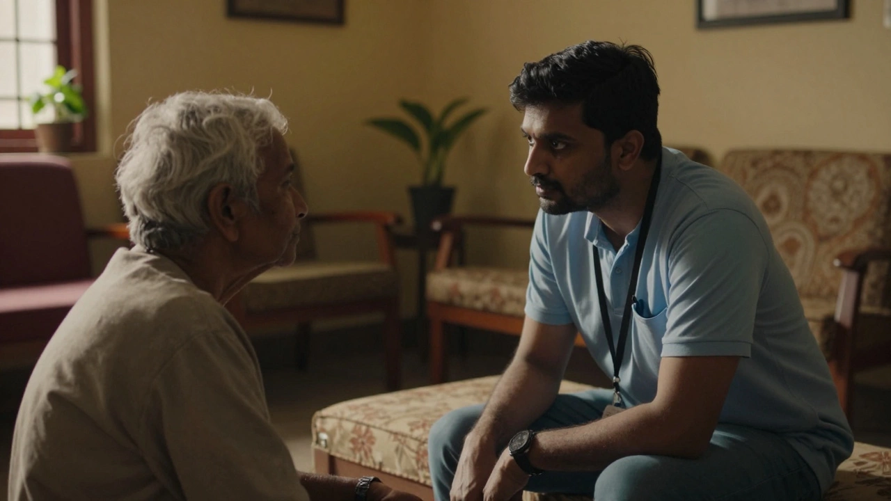 Volunteer listening empathetically to an elderly person indoors
